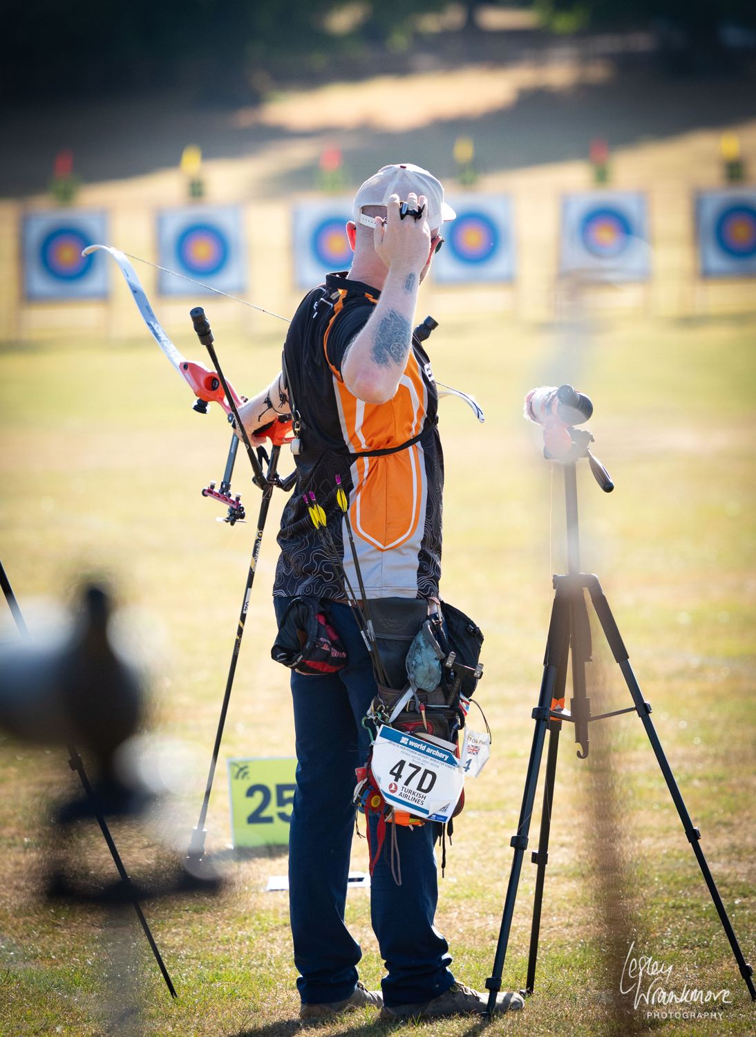 Patrick Huston on the shooting line at a World Archery event, bow on his shoulder